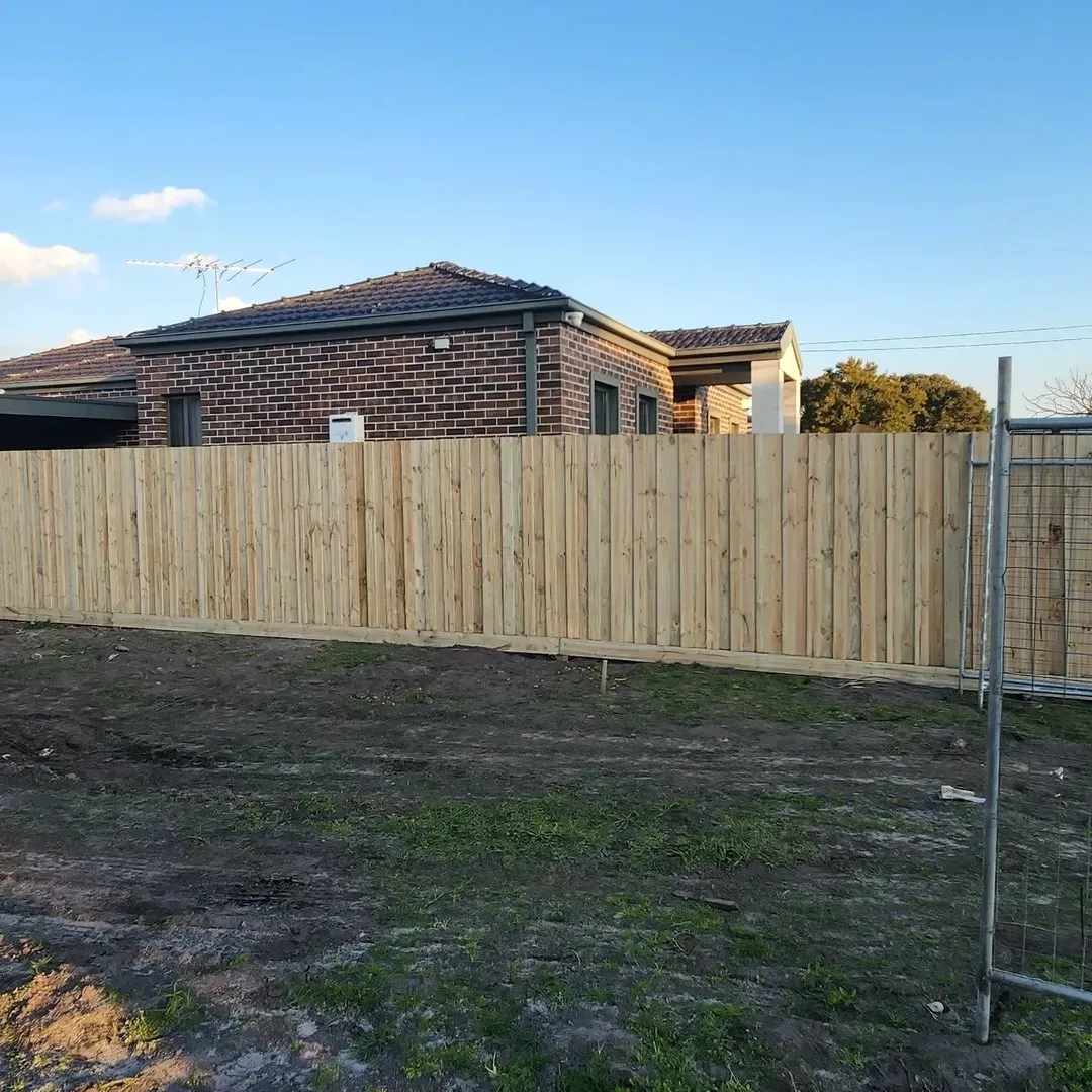 New timber paling boundary fence at a residential construction site